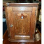 A 9 1/4" Arts & Crafts inlaid polished oak miniature corner cabinet