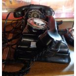 A vintage wall mounted Siemens telephone and another