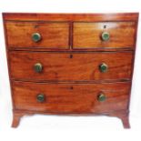 A 35" late Georgian mahogany and strung chest of two short and two long graduated drawers, set on