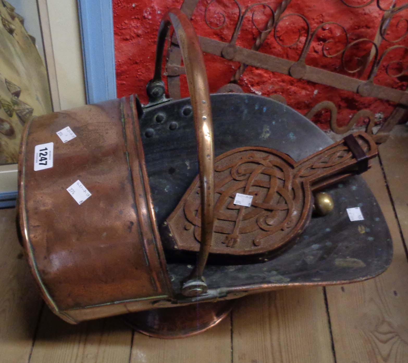 An antique copper coal scuttle, a pair of bellows, etc.