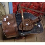 An antique copper coal scuttle, a pair of bellows, etc.