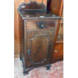 A 15 1/4" early 20th Century walnut pot cupboard with decorative moulding, set on bracket feet