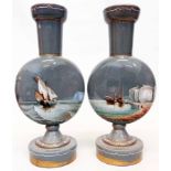 A pair of grey glass moon vases with hand painted coastal scenes