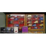 A collection of Lledo model cars in display cases and further boxed model cars including Corgi