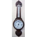 A late Victorian oak cased banjo barometer/thermometer with printed ceramic dials and aneroid