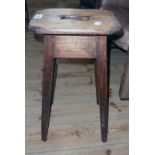 A Victorian stained pine rustic stool with pierced top and square tapered supports