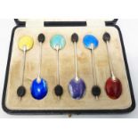 A cased set of six enamel backed silver coffee bean spoons - a/f