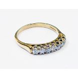 An import marked 750 gold, seven stone diamond ring - 0.5ct. TDW