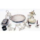 A quantity of small silver plated items including four pairs of knife rests, a lidded butter dish,