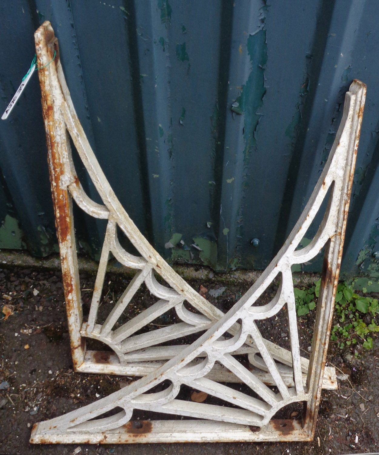 Two small Victorian painted cast iron sunburst brackets