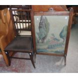 An early 20th Century stained oak framed firescreen with woolwork panel under glass - sold with an