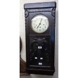 An early 20th Century stained and carved oak cased wall clock - a/f