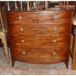 A 3' 6" late Georgian mahogany bowed chest of two short and three long graduated drawers, set on