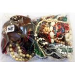 A bag containing a quantity of assorted costume jewellery