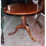 A 27" diameter 19th Century stained wood bird cage pedestal table, set on turned pillar and tripod