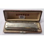 A cased vintage Hohner 64 Chromonica four octave harmonica in C - a/f