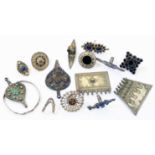 Various Persian ornate white metal rings and pendants, etc.