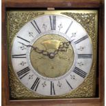 An antique oak longcase clock with later carved decoration, the 11" brass and silvered square dial