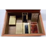 A Rolex box (a/f) containing five S.T. Dupont gas cigarette lighters comprising two vintage Ligne