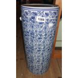 A blue and white ceramic umbrella stand