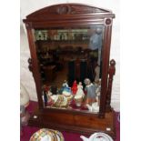 A large Edwardian walnut framed swing dressing mirror