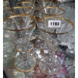 A set of six conical glasses with gilt banding and monogram