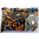 A bag containing a large quantity of assorted costume jewellery