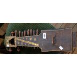 An Indian sarangi with seventeen strings - length 22"