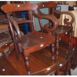 A set of six early Victorian mahogany dining chairs with curved back rails and solid seats,