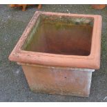 A large square terracotta planter