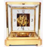 A Jaeger-Le-Coultre Atmos table timepiece with gilt metal and glazed case, 4 3/4" open square dial -