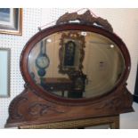 A 3' 9 1/2" late Victorian walnut framed bevelled oval mirror with applied decorative moulding to