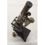A late Victorian R. & J. Beck Ltd. Star compound microscope on cast iron base, with additional lens
