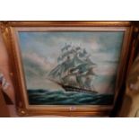 A 20th Century oil on canvas, depicting a three masted sailing ship on choppy seas - indistinctly