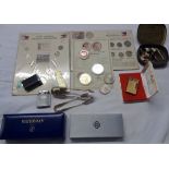 Various collectables including commemorative coins, lighters, pens, etc.