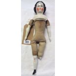 A mid 19th Century Germany unmarked Biedermeier doll with porcelain head and shoulders featuring