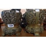 A pair of pierced brass oil lamp bases