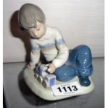 A Nao figure of a child with a train