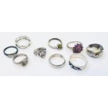 A selection of assorted white metal rings