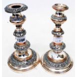 A pair of 8" antique silver plated copper ornate candlesticks - a/f