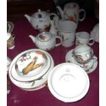 A quantity of Royal Worcester Evesham ware including teapot, condiment set, cups, etc.