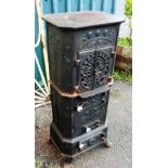 A 16 1/2" modern upright cast iron wood burner in the Art Nouveau style, with moulded flower heads