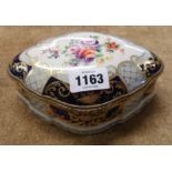 A mid 20th Century French porcelain box with hand painted decoration by le Tallec of Paris