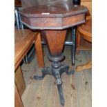 An 18" Victorian walnut trumpet work table, the octagonal hinged lid enclosing fitted interior