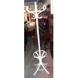 A modern free standing painted bentwood hat and coat stand