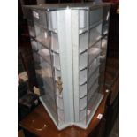 A perspex fronted revolving display cabinet with three locking doors - 26" high