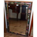 A decorative gilt and printed floral bordered bevelled oblong wall mirror