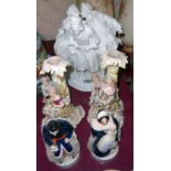 Two continental porcelain candle holders - sold with a pair of continental figures and a continental