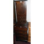 A reproduction mahogany cross banded CD cabinet and matching media cabinet