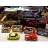 A collection of mostly boxed die cast Volkswagen vehicles including Burago 1955 gold Kafer Beetle,